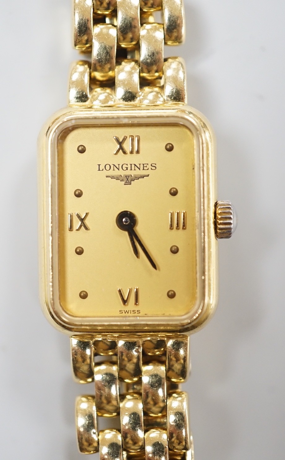 A lady's 2001 18ct gold Longines quartz wrist watch, with rectangular part Roman dial, on 18ct gold Longines bracelet, with original receipt and papers, no box